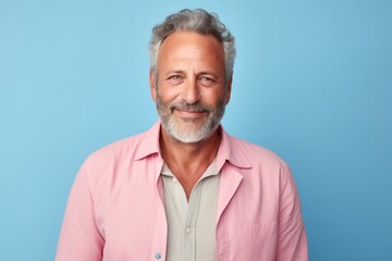 portrait of a Israeli man in his 50s wearing a chic cardigan against a pastel or soft colors...