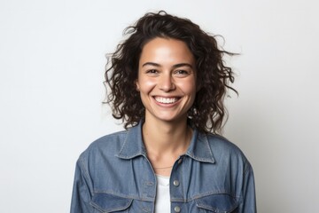 portrait of a Israeli woman in her 30s wearing a denim jacket against a white background
