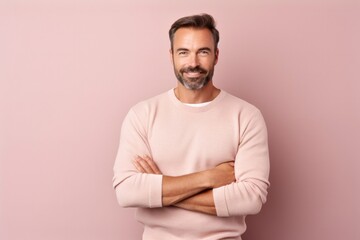 medium shot portrait of a Polish man in his 30s wearing a chic cardigan against a pastel or soft colors background