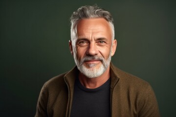 Obraz premium medium shot portrait of a Polish man in his 50s wearing a chic cardigan against an abstract background