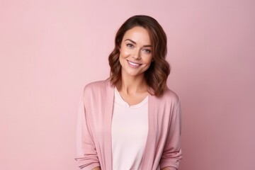 Obraz premium medium shot portrait of a Polish woman in her 30s wearing a chic cardigan against a pastel or soft colors background