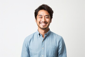 portrait of a Japanese man in his 30s wearing a foulard against a white background