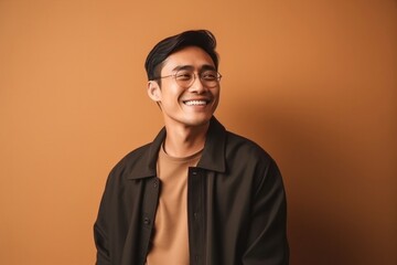 Obraz premium medium shot portrait of a confident Filipino man in his 30s wearing a chic cardigan against an abstract background