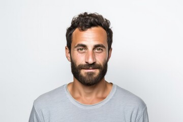 medium shot portrait of a confident Israeli man in his 30s wearing a chic cardigan against a white background