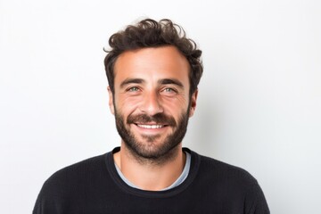 medium shot portrait of a confident Israeli man in his 30s wearing a chic cardigan against a white background