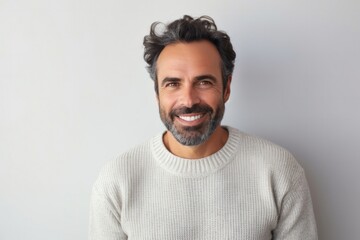 Fototapeta premium medium shot portrait of a confident Israeli man in his 40s wearing a cozy sweater against an abstract background