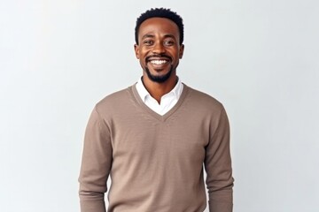 medium shot portrait of a confident Kenyan man in his 30s wearing a chic cardigan against a white background