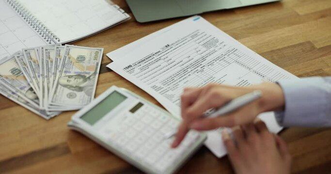 Tax deduction form and calculator. Concept of paying taxes and filing tax return