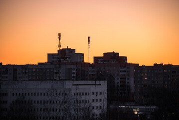 A soviet building on sunset in evening in winter