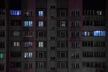 Fototapeta na wymiar A soviet building in the city in evening in winter