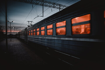 An electric train at evening in winter