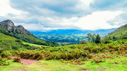Magnificent landscape of the Basque Country and its green mountains taken during a hike on the Rhune