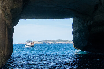 Es Pont de n'Ali, an incredible tunnel in the cliffs. A natural arch that has been eroded into the...