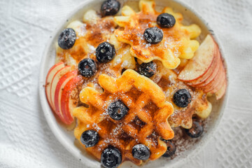 Waffles with honey and blueberries