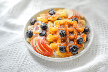 Waffles with honey and blueberries