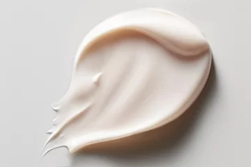 Fotobehang White Beige Texture of Cosmetic Face Cream Smear. Swatch smudge concealer, smear hand cream, hair mask. Light beige white liquid, highlighter, BB, CC cream makeup texture of liquid. © IrynaV