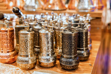 Traditional Turkish copper ornated pepper mills. Close up, souvenir from Turkey (Turkiye)