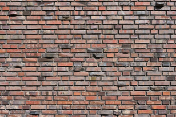 Clay brick background. Brick walls of red brick. Brick wall as background. Clinker .