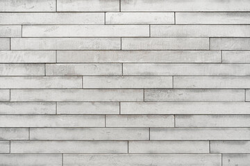 White marble granite wall. The facing facade of the building as a background of natural stone.