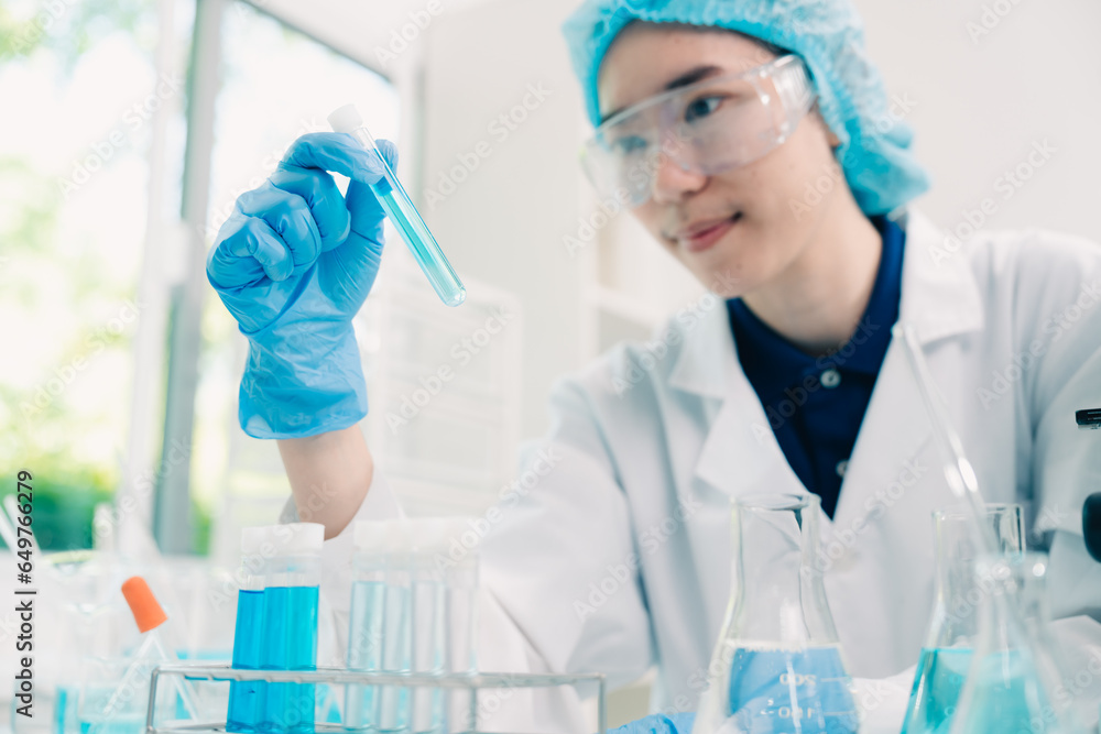 Wall mural scientist analyzing and dropping a sample into a glassware, medicine science experiments containing 