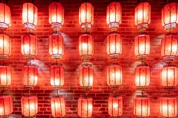 Poster Red lanterns hung on the wall at night © onlyyouqj