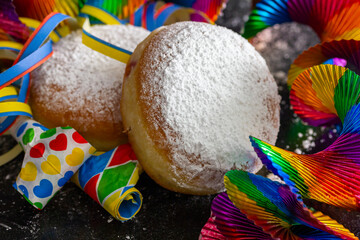 Pancakes (doughnuts) with powdered sugar and party decoration