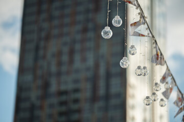 Decorative light bulbs and building on a background