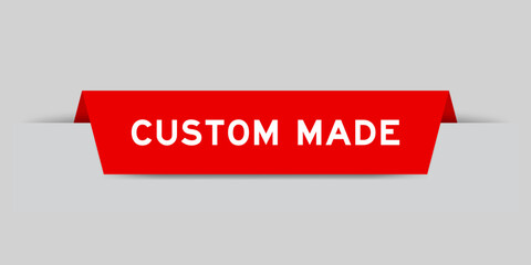 Red color inserted label with word custom made on gray background