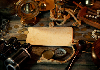 Treasure island concept on a wooden table background. Sheet of paper for text or map	