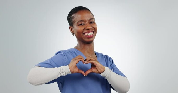 Heart, sign and portrait of black woman doctor with love isolated in a studio white background. Portrait, medical and worker in healthcare with feedback as success, support or care hand gesture