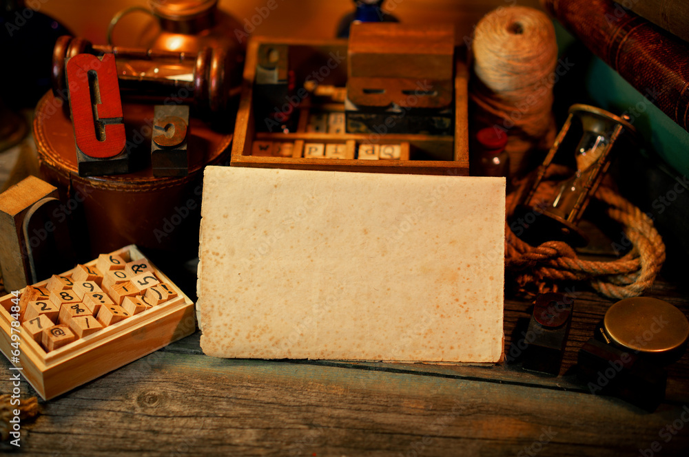 Fototapete vintage sheet of paper on wooden table. retro type objects and old wooden typographic blocks. letter