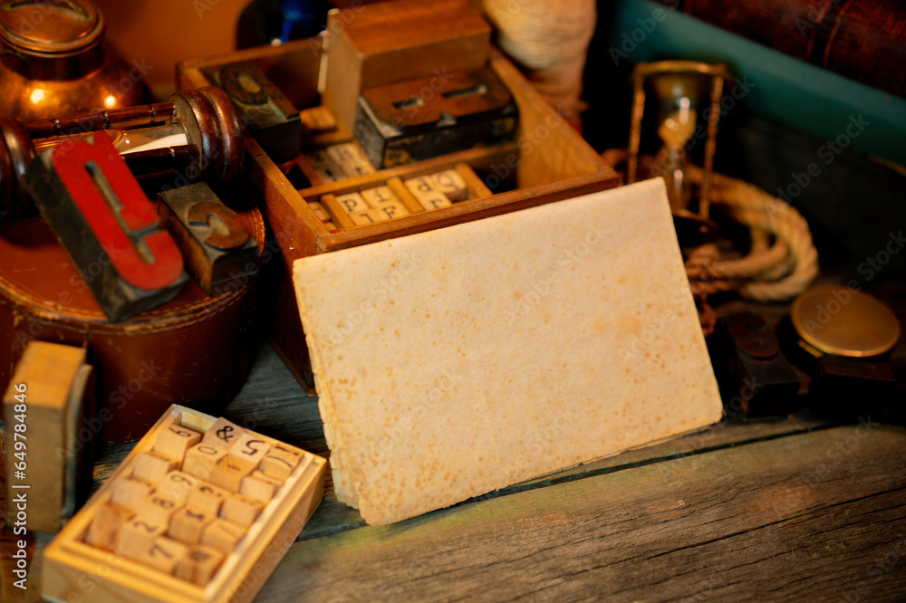 Fototapete vintage sheet of paper on wooden table. retro type objects and old wooden typographic blocks. letter