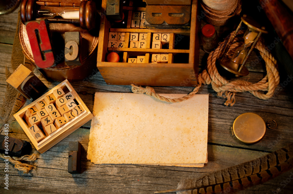 Fototapete vintage sheet of paper on wooden table. retro type objects and old wooden typographic blocks. letter