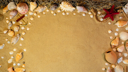 Beach theme. Free space on the sand among shells, stones and marine elments. Frame on the sand...