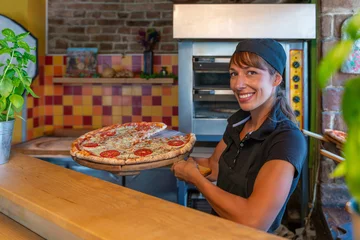 Fotobehang Serving delicious pizza slices in pizza shop © Microgen