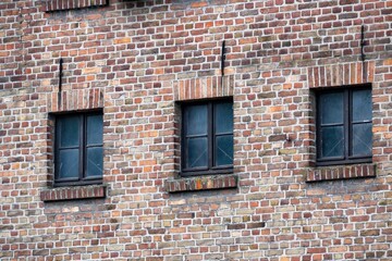 old brick wall with windows