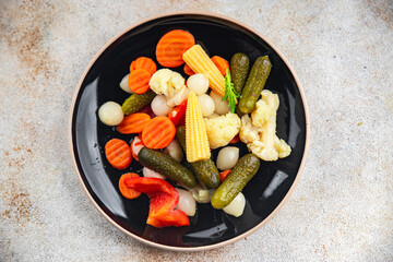 salad pickled vegetable cucumber, gherkin, carrot, onion, cauliflower, pepper appetizer meal food snack on the table copy space food background rustic top view