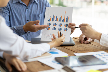 Business meeting, brainstorming sessions discuss analysis of investment growth graph and market...