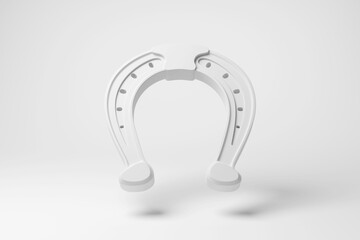 White horseshoe floating in mid air on white background in monochrome and minimalism. Illustration of the concept of horse racing and equestrian