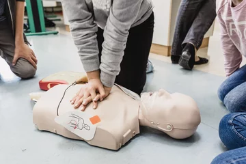 Tapeten First aid cardiopulmonary resuscitation course using automated external defibrillator device, AED. © kasto