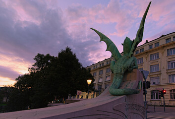 Detailed view the statue of Green Dragon on famous Dragon bridge. Rear view. Dragon bridge (Zmajski most) is one of the symbols of Ljubljana. Tavel and tourism concept