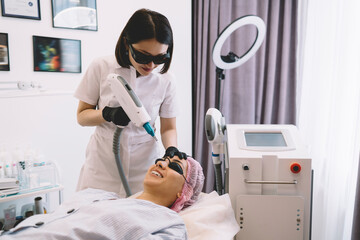 Cheerful woman during appointment of cosmetic procedure