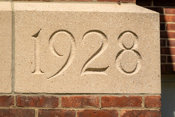 Concrete block, 1928 building cornerstone.