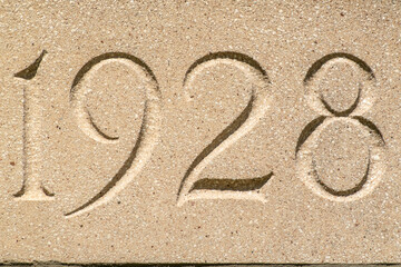 Concrete block, 1928 building cornerstone. - obrazy, fototapety, plakaty