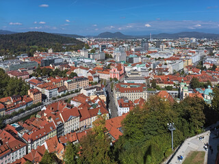 Ljubljana, Slovenia. High angle view over the central and north-west parts of the city with Franciscan Church of the Annunciation in the centre of the image. View from Castle Hill. - 649828411