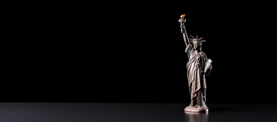 Statue of Liberty figurine symbolizing hope isolated on a white background 