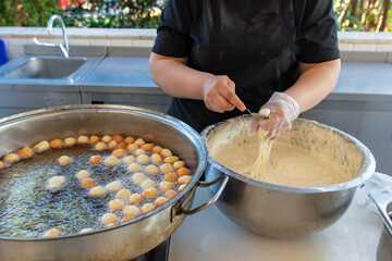 Cooking fried donuts in butter