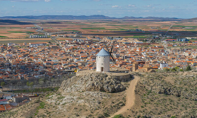 Hilltop windmills, silhouette against the Spanish sky. Toledo's history, culture, and scenic beauty...