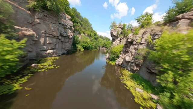 FPV, Ukrainian canyon in the village of Buki, Amazing aerial view of Buky canyon on a sunny day. Buka canyon on the Girsky Tikich river, Cherkasy region, Ukraine. Concept, travel, outdoor recreation, 