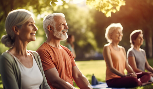 A group of senior happy woman and man are meditating relaxed and mindfull with a yoga mat in a city beautiful park on a sunny day